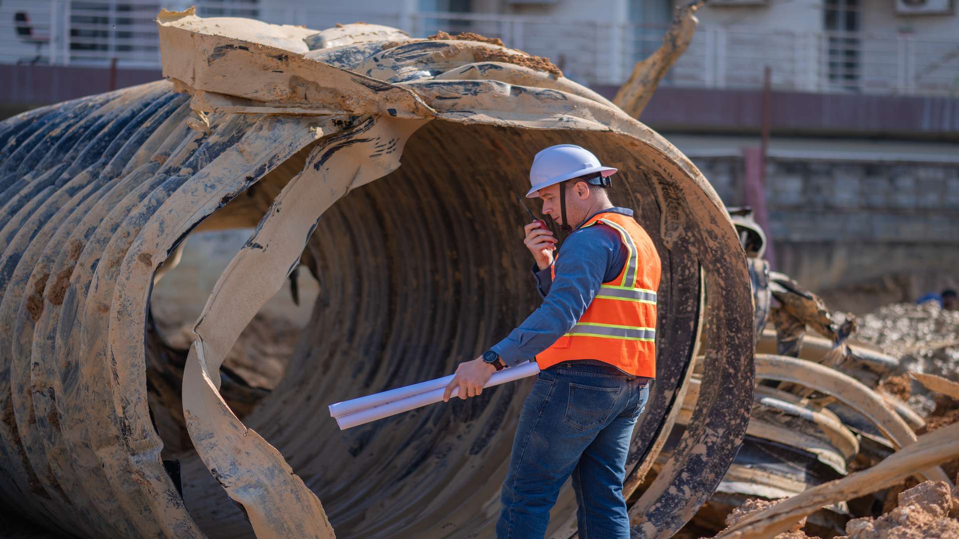 Construction,Surveyor,Or,Engineer,Working,Inspection,Damaged,Black,Corrugated,Pipe