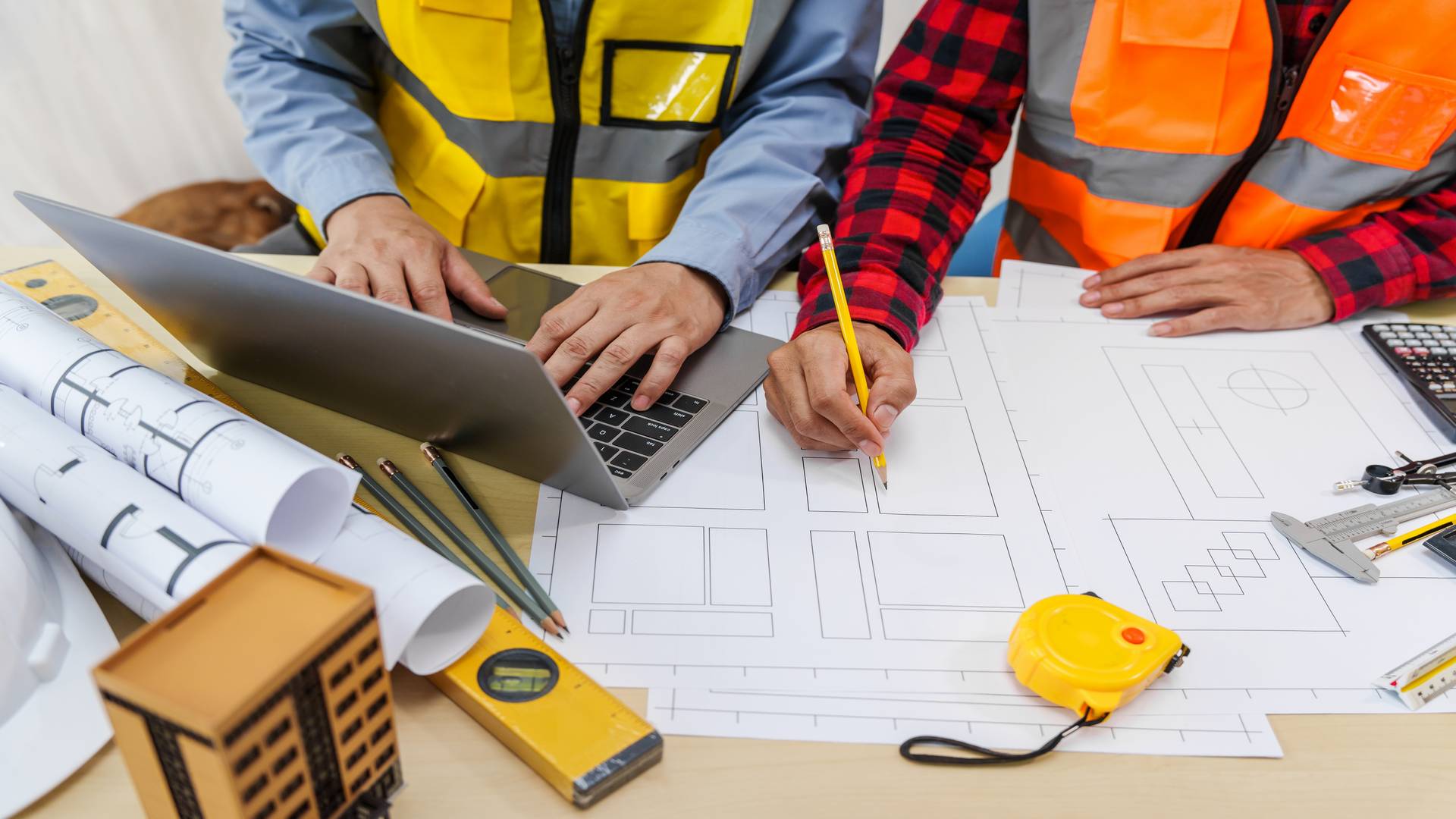 Two,Men,,Including,A,Male,Asian,Construction,Contractor,Engineer,,Discuss